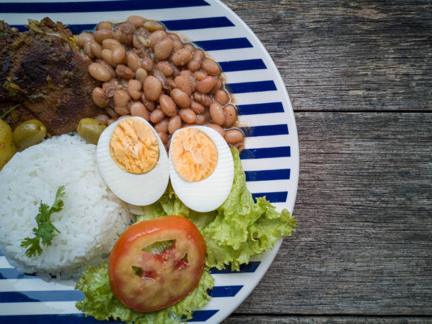 istock Food dish. Beans, rice, meat, salad, egg. Rustic wood background. Flat Lay. 1210627279