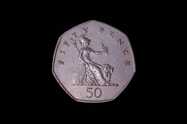 50 pence UK coin with warrior isolated on the black background