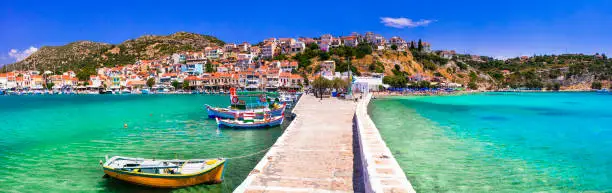 Photo of Traditional colorful Greece - travel in beautiful Samos Island, scenic Pythagorion town. view with traditional boats
