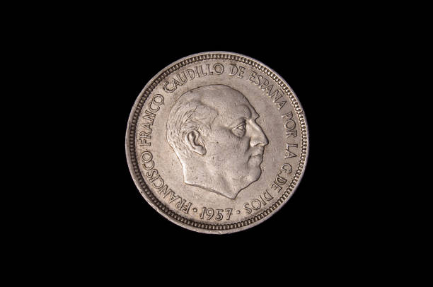 istock 5 Pesetas coin isolated on the black background 1210633100