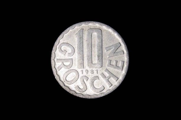 istock 10 Groschen coin isolated on the black background 1210633153