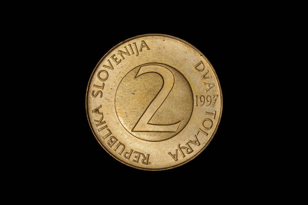 istock 2 tolar Slovenian coin isolated on the black background 1210633174