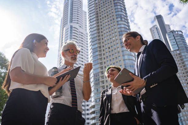 istock Business team standing in a financial district discussing ideas 1210634273