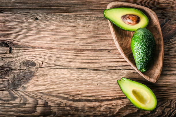 istock Avocado on old wooden table. 1210634350