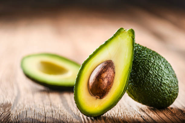 istock Avocado on old wooden table. 1210634359