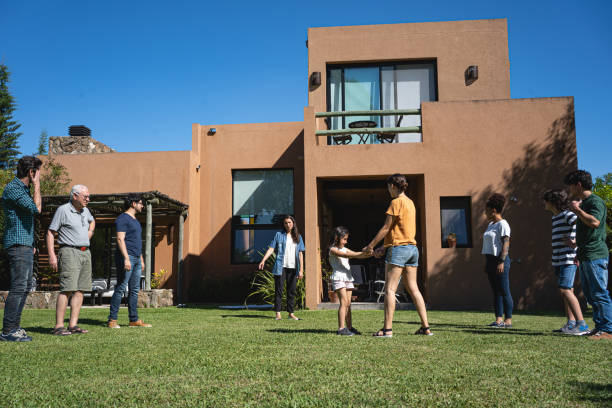 istock Family doing physical activity together in the back yard 1210634825