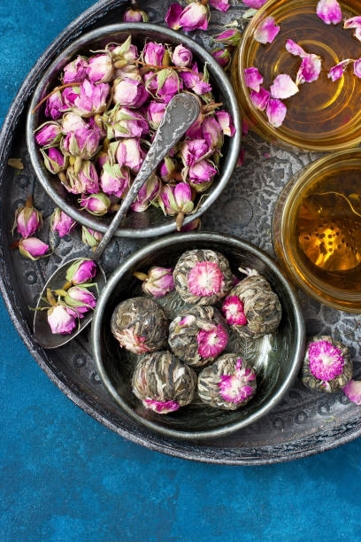 istock Composition with tea mugs and rose buds on tray 1210634889