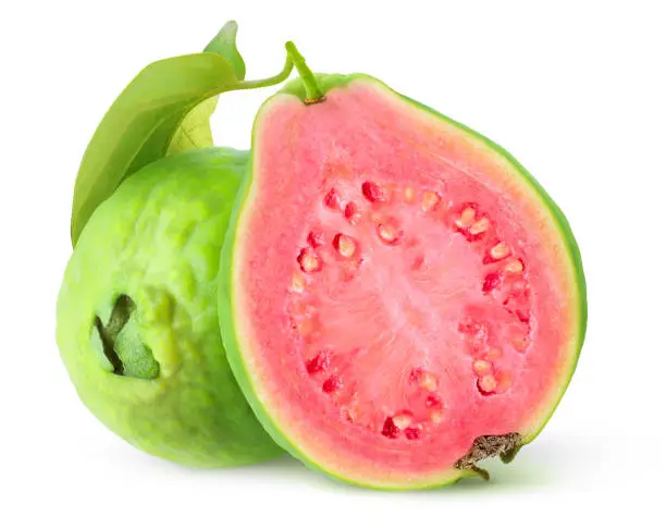 Isolated guavas. Cut guava tropical fruits with green skin and pink flesh isolated on white background