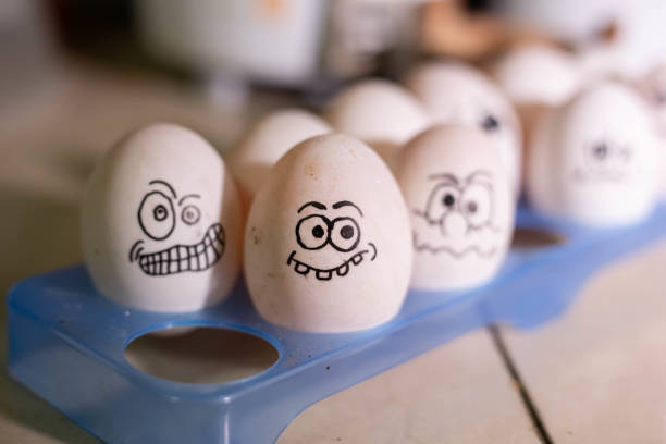 istock Emotionally eggs in the fridge tray. Real hand-painted eggs 1210638021