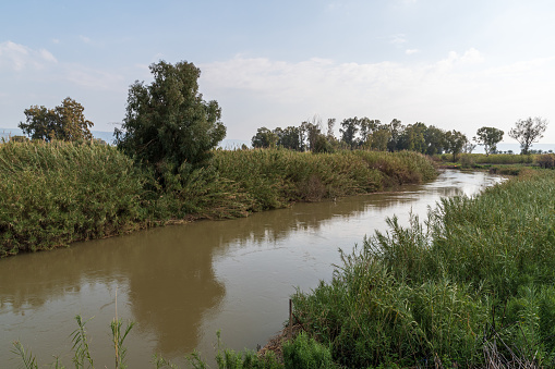 Wide angle view of the Jordan river, near the Golan heights