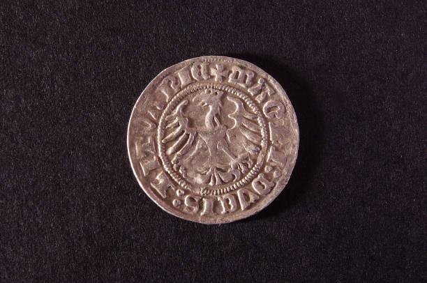 istock Old Grand Duchy of Lithuania coin  half-grosz isolated on the dark background 1210644607