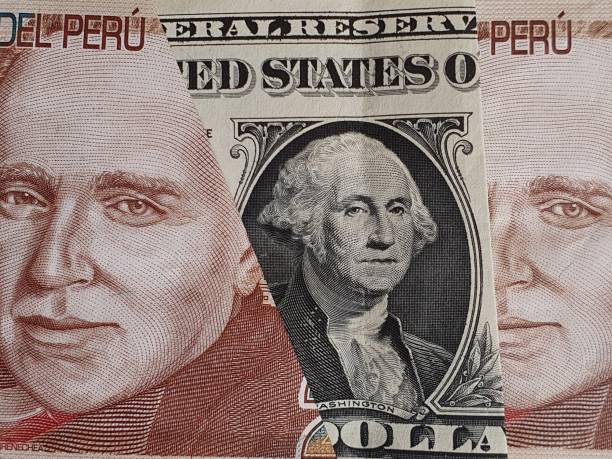 istock approach to American one dollar bill and peruvian banknotes 1210645893