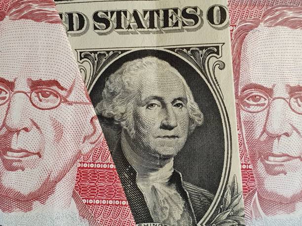 istock approach to American one dollar bill and guatemalan banknotes 1210645925