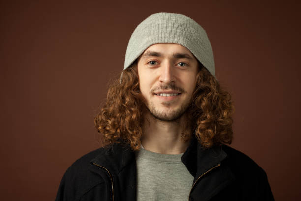 istock studio portrait of a young man with a beard on a brown background 1210649224