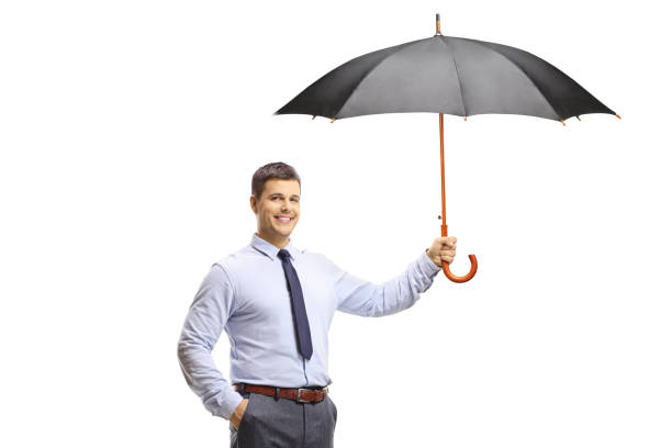 Elegant young man holding an umbrella and smiling isolated on white background