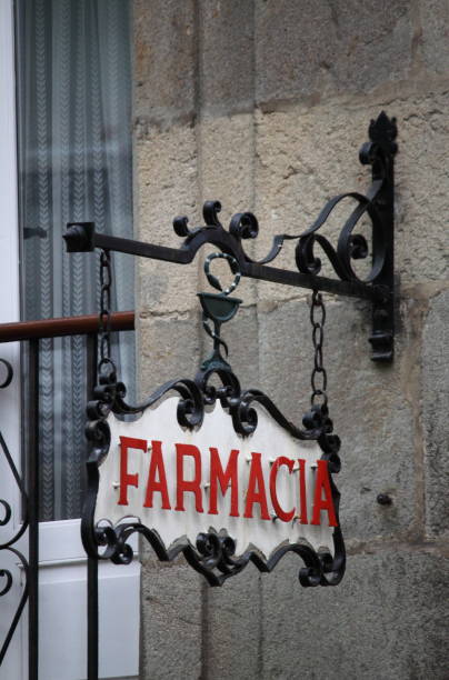 Pharmacy sign carved on stone in medieval styling