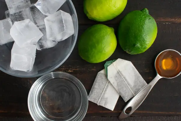 Ingredients to make traditional Vietnamese iced green tea with lime and honey