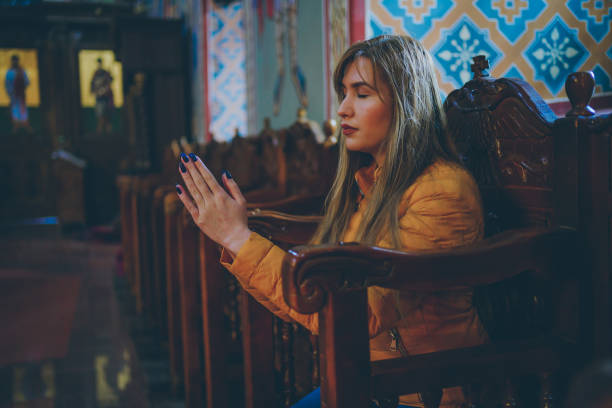 Senior muslim woman praying at home