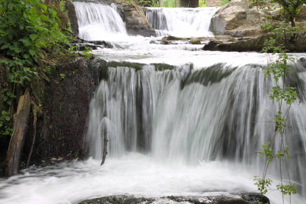 Beautiful rapids between vegetation near Monte Gelato waterfalls stock photo