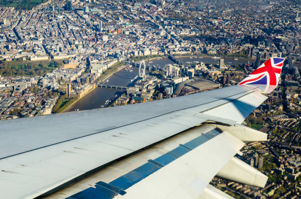 Commercial flight passing over London while descending to the airport View from a commercial flight passing over London city centre while descending to the airport city of westminster london photos stock pictures, royalty-free photos & images
