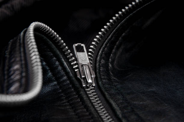 istock Iron zipper on a black leather jacket, needlework concept. 1210657748