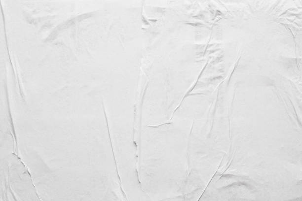 istock Blank white crumpled and creased paper poster texture background 1210658957