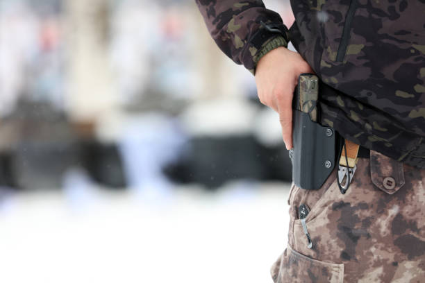 istock A man holding a gun in case 1210659001
