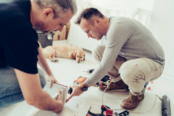 istock Two men building a dog house 1210662231