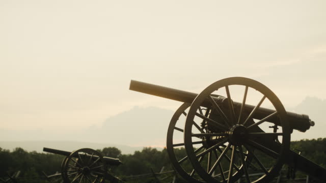 Several US Civil War Cannons from Gettysburg National Military Park, Pennsylvania on a Hazy Day at Sunset