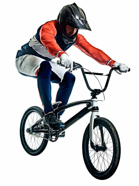 BMX racer man silhouette isolated white background one caucasian BMX racer jumping  in studio silhouette  isolated on white background bmx racing stock pictures, royalty-free photos & images