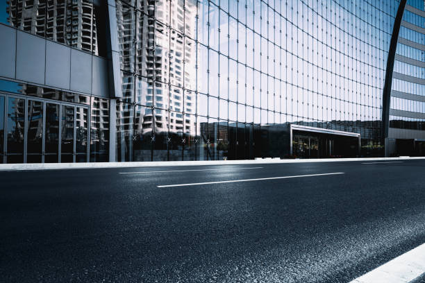 istock Asphalt road High way Empty curved road clouds and sky at sunset 1210670750