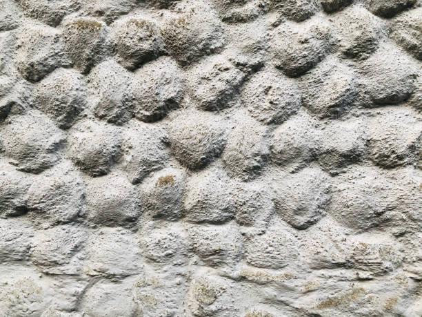 istock Grey stone grain bubble pattern wall spray painted textured and scratched concrete background in retro style with copy space 1210672553