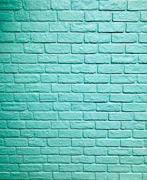 istock Blue aqua stone brick block pattern wall spray painted texture concrete background in retro style with copy space 1210672570
