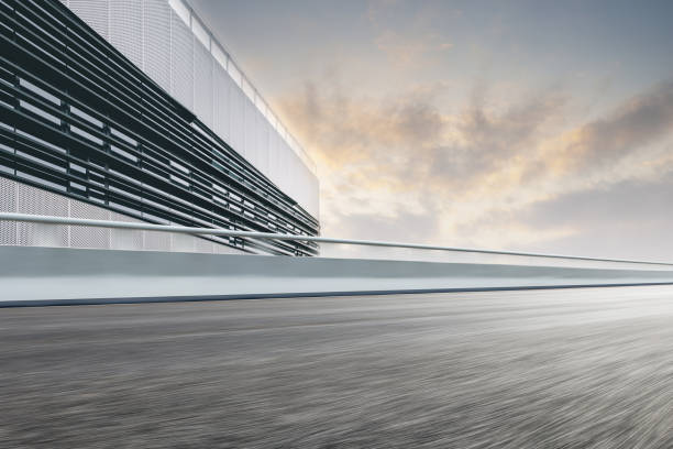 istock Divided highway passing through city buildings, blue nostalgia high contrast 1210673620