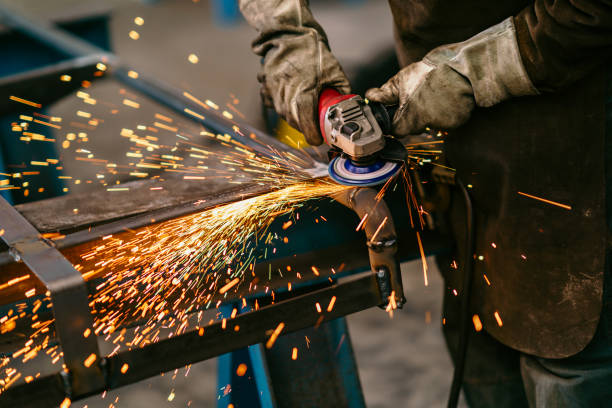 istock Factory worker grinding a metal,close up 1210674254