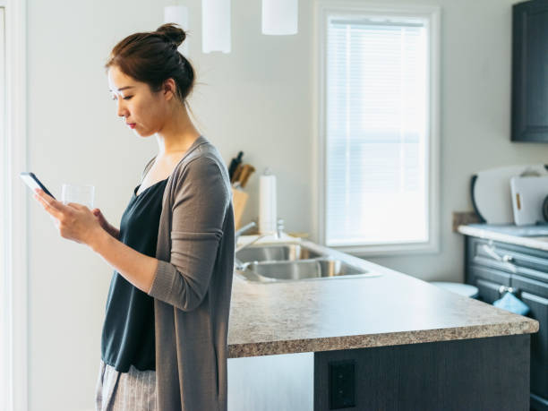 istock asian woman using smart phone 1210674618