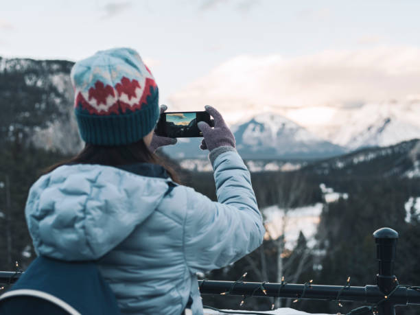 istock woman taking photo with phone 1210674716