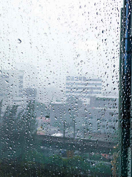 city in the rain, condensation on window