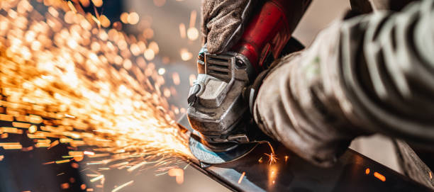 istock Factory worker grinding a metal,close up 1210675715