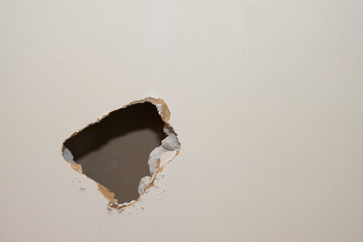 A hole in the drywall to start a remodel project.