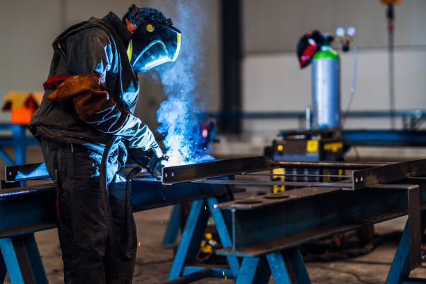 istock Professional welder with protection mask 1210678641