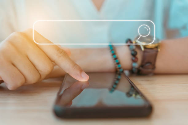 istock People hand using mobile phone or smartphone searching for information in internet online society web with search box icon and copyspace. 1210681554