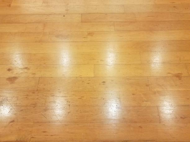 istock brown wood floor with glare or reflection 1210682608