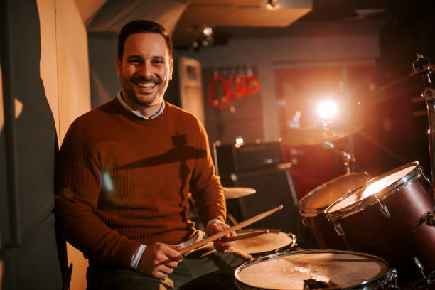 istock Portrait of a happy drummer in studio. 1210684753