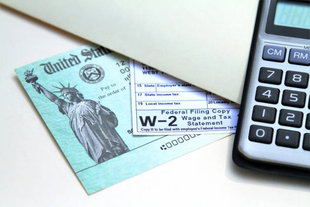 istock Tax form with Treasury check and calculator 1210685012