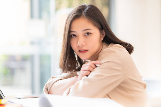 istock Architect or interior designer working with material sample board in showroom. Business of Real estate, home decoration .Creative people workplace.  young designer woman working with color palette at office desk. 1210686777