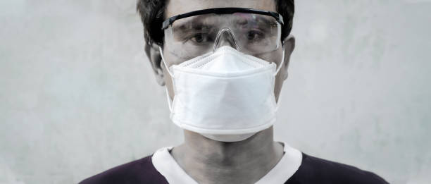 istock Self-protection and disease control from COVID-19 outbreak in crowded area and public transportation, Asian man wearing sergerical mask. 1210688600