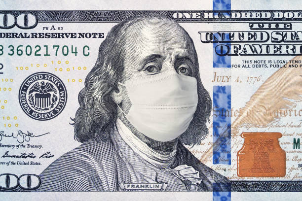 American President with face mask against CoV infection. 100 dollar banknote. Coronavirus in United States. Concept quarantine and recession. Global economy hit by corona virus outbreak and pandemic American President with a face mask against CoV infection. 100 dollar banknote. Coronavirus in United States. Concept quarantine and recession. Global economy hit by corona virus outbreak and pandemic stock certificate photos stock pictures, royalty-free photos & images