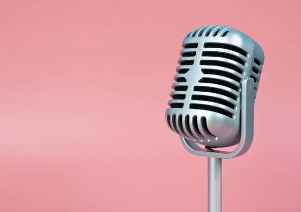 Photo of Microphone retro with copy space on pink background