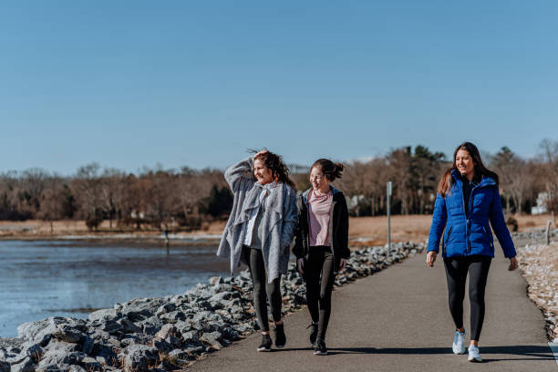 istock Family walking together in a park 1210694166